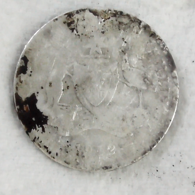 The Better Side (Obverse) of the coin in round second of the ultrasonic coin cleaning process